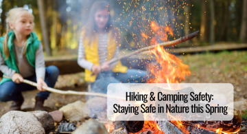 image of two young girls roasting marshmallows over a campfire